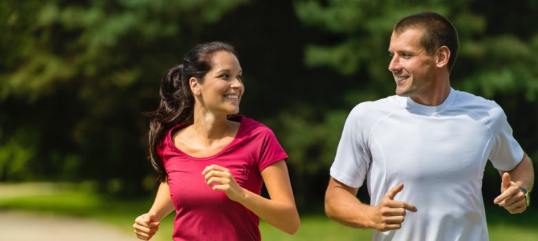 Couple Running In Park