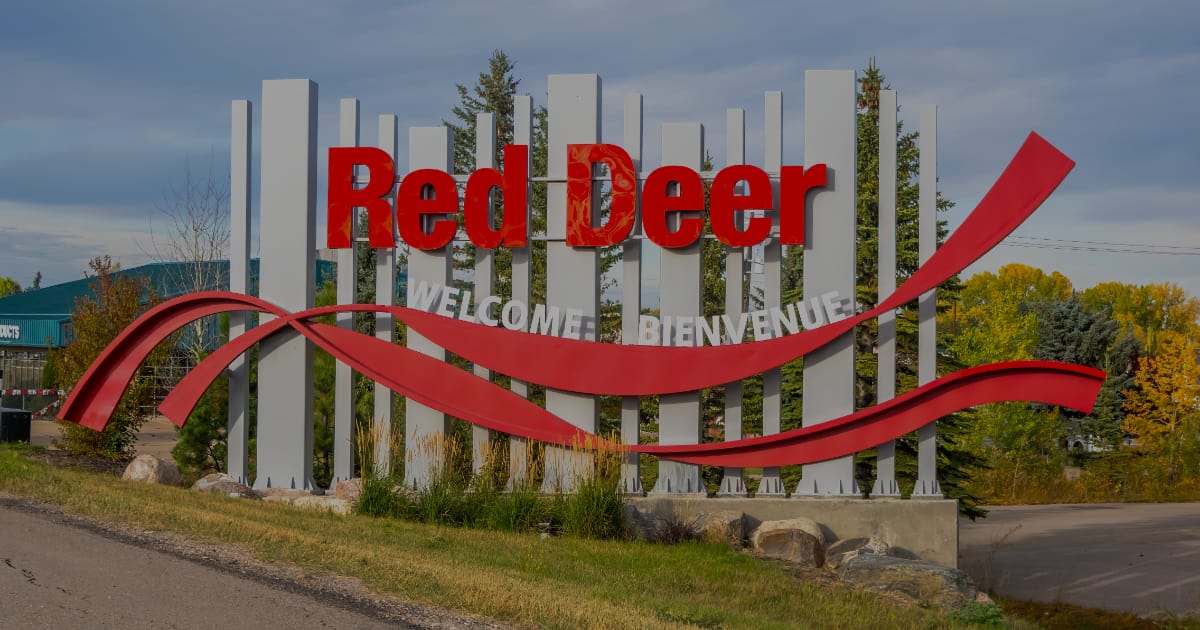 5 benefits of living near Gasoline Alley, Red Deer welcome sign featured image