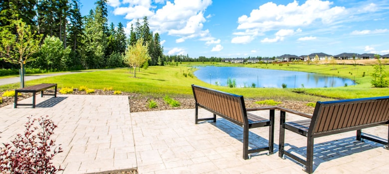 sitting benches at the pond in Harvest Ridge image